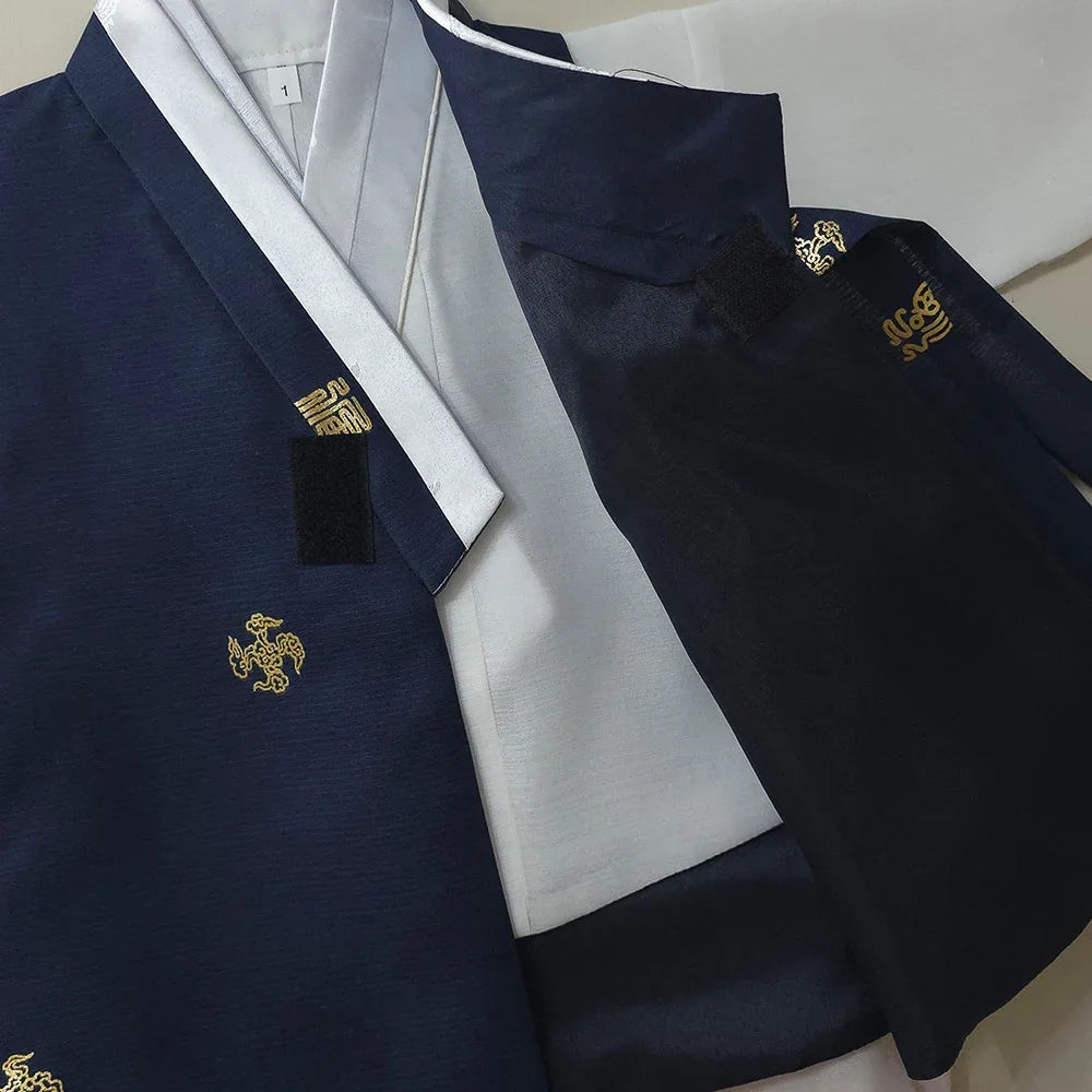 Close-up of a navy blue Native Korean boy hanbok with gold embroidered patterns.