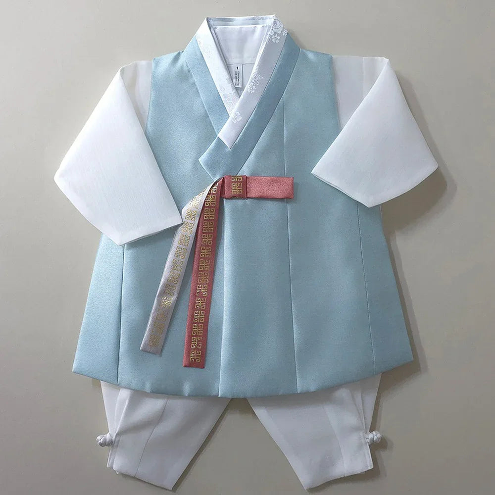Eunkyo Sky Vest Boy Hanbok by Native Korean with a light blue vest and white trousers.
