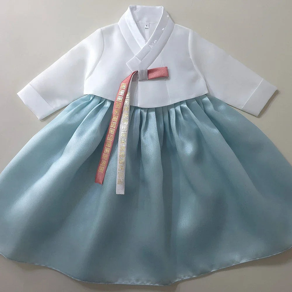 Eunkyo Sky Girl Hanbok by Native Korean with a white jeogori and sky blue chima.