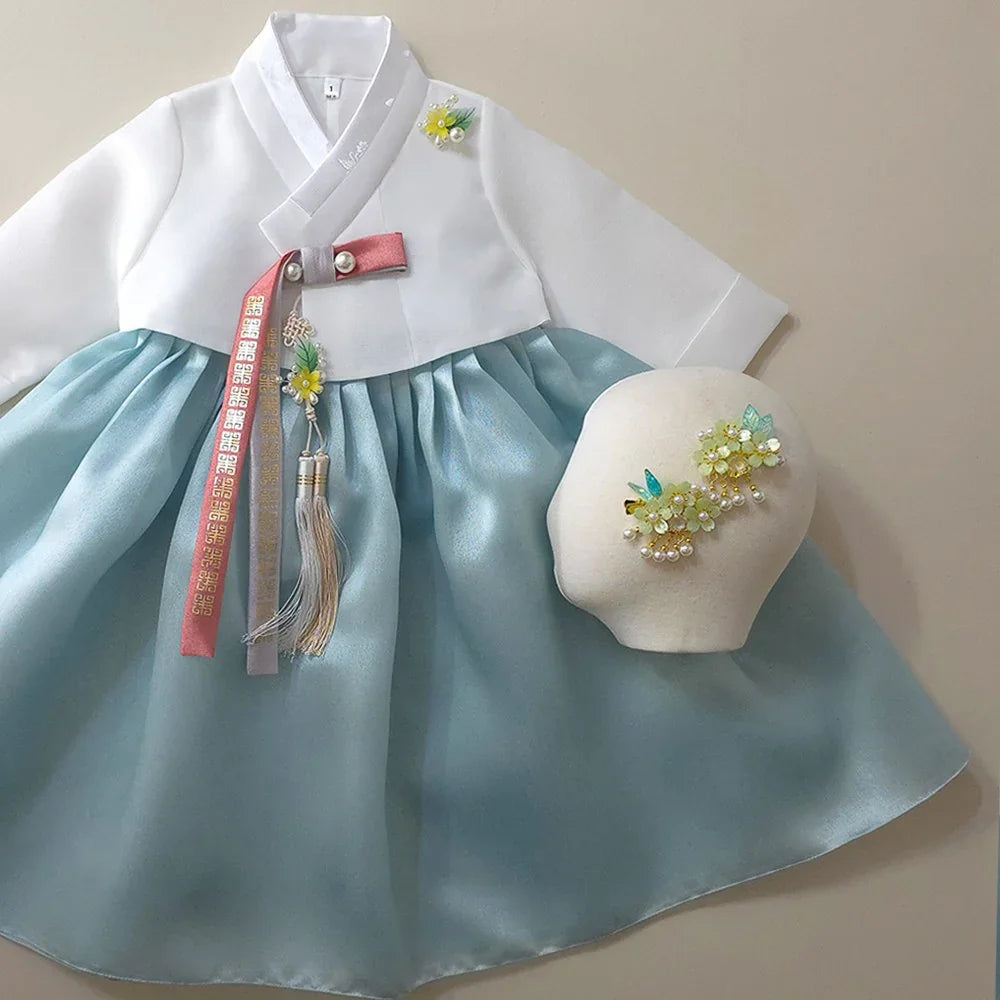 Eunkyo Sky Girl Hanbok by Native Korean with a matching Norigae and floral hair accessory.