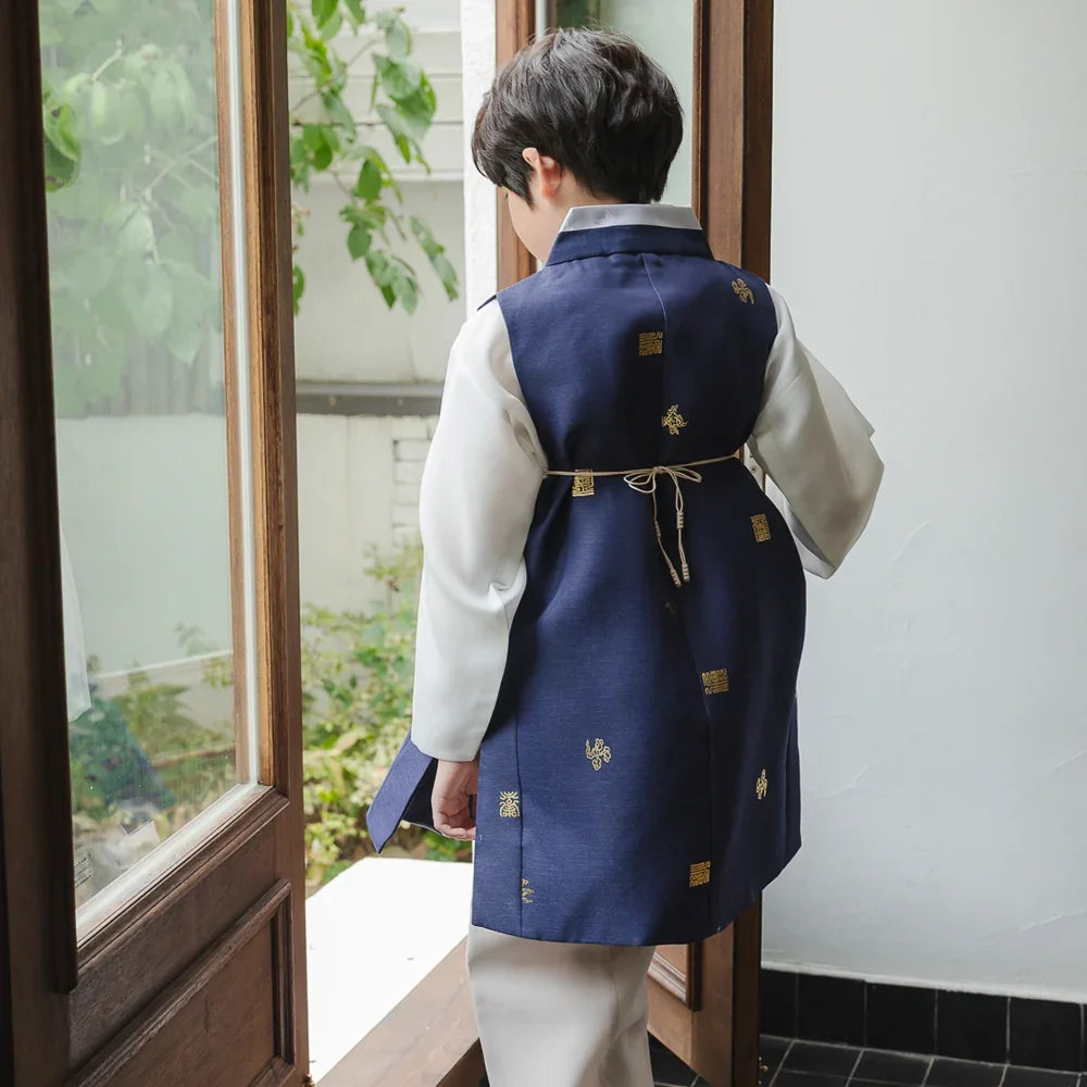 Back view of a child wearing a navy blue and white Native Korean Boy Hanbok.