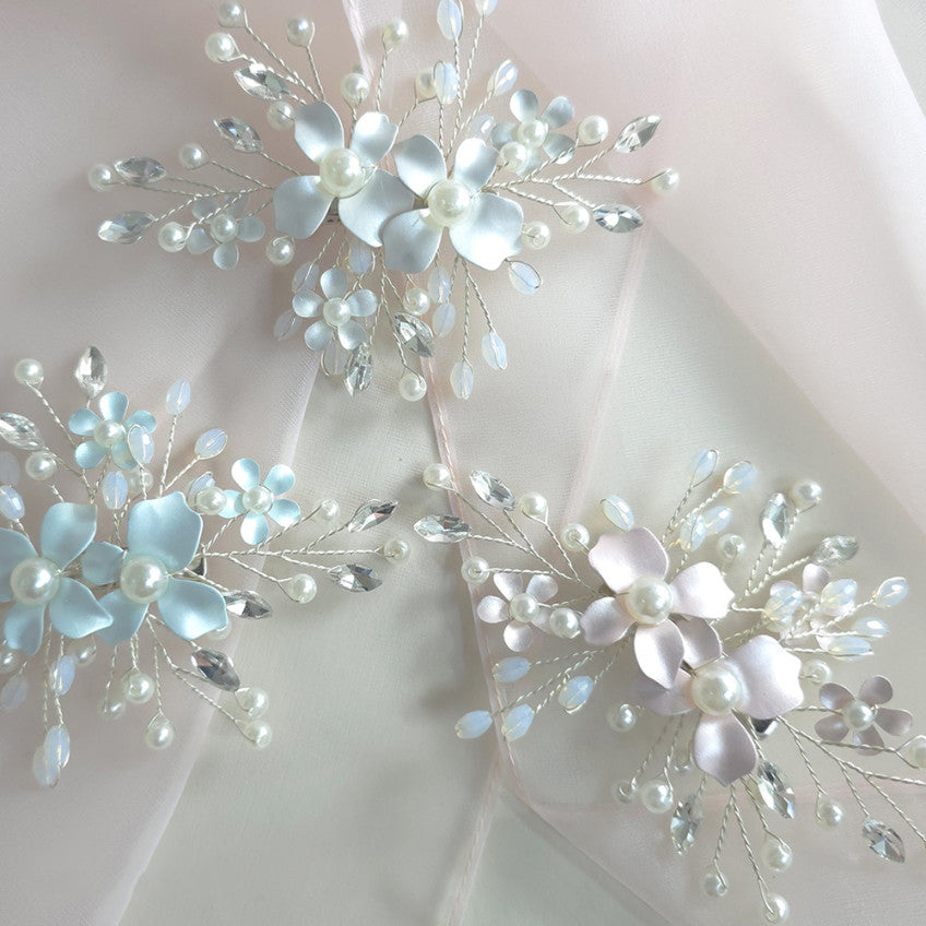 Decorative floral arrangement with pearls on a light background