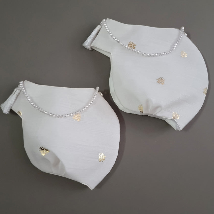 Yebon Jobawi traditional Korean girl hanbok winter hat featuring gold foil accents, a decorative front tassel, and pearl trim for Dol, Baek-il, and Korean celebrations.