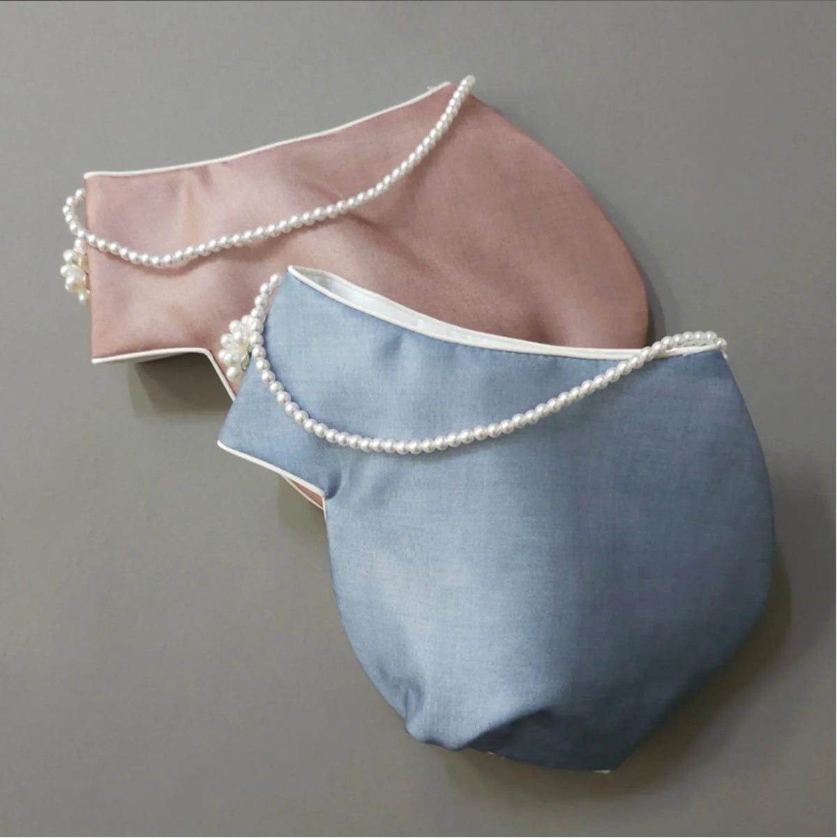 Pink and blue Native Korean Yuhee Jobawi hats with pearl embellishments.