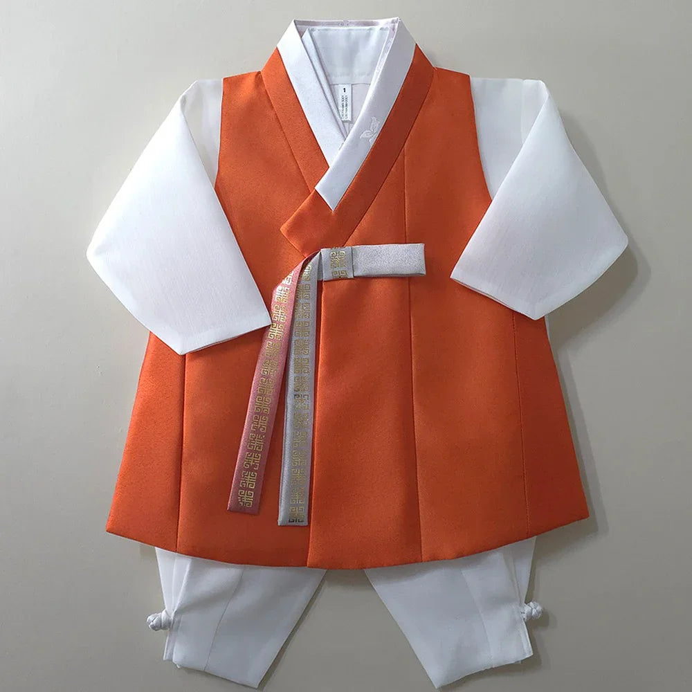 Eunkyo Coral Vest Boy Hanbok by Native Korean featuring a coral-colored vest over a white ensemble.