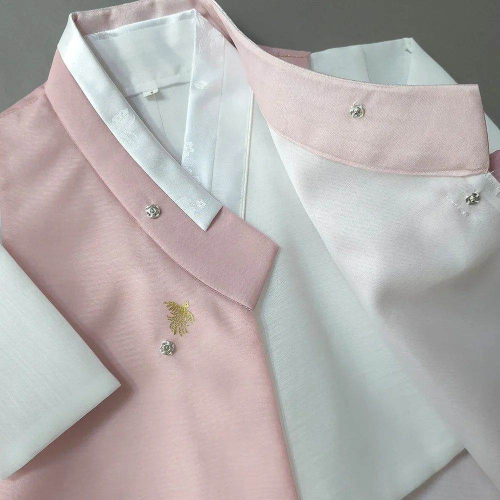 Close-up of Heesung Pink Boy Hanbok by Native Korean with gold embroidery and buttons.