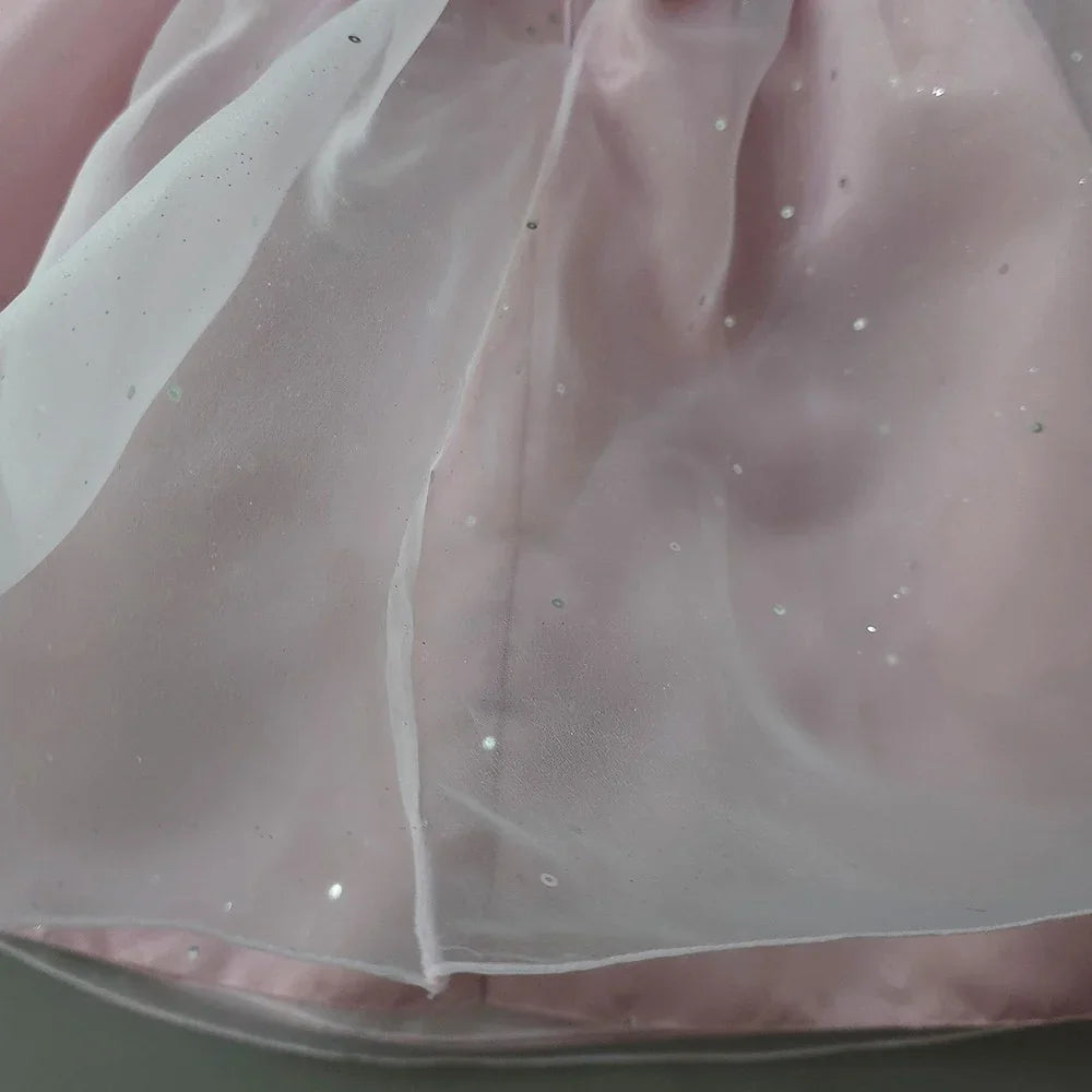 Close-up of a Pearl Sky Pink Girl Hanbok by Native Korean with shimmering details.