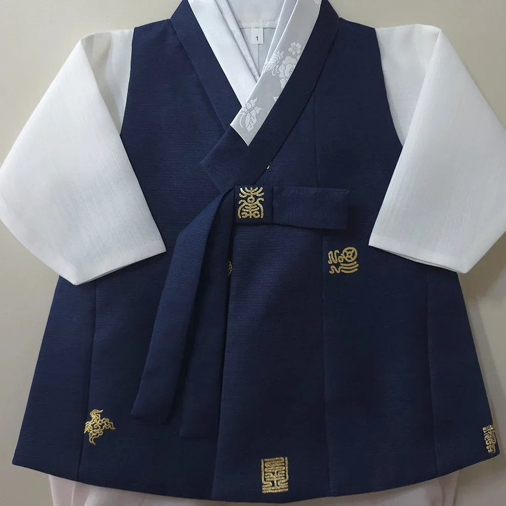 Native Korean navy blue boy hanbok with gold embroidery and white sleeves