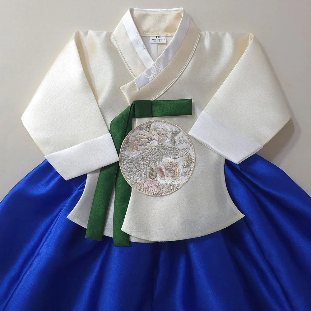 Yoonseo Blue Girl Hanbok by Native Korean with a white jeogori and blue chima.