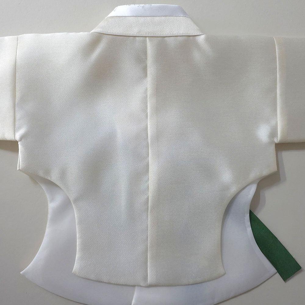 Back view of a white Native Korean girl hanbok jacket with a green ribbon detail.