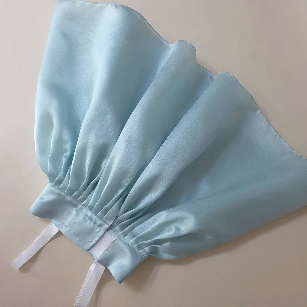 Close-up of the light blue satin skirt of a Native Korean Eunkyo Girl Hanbok.