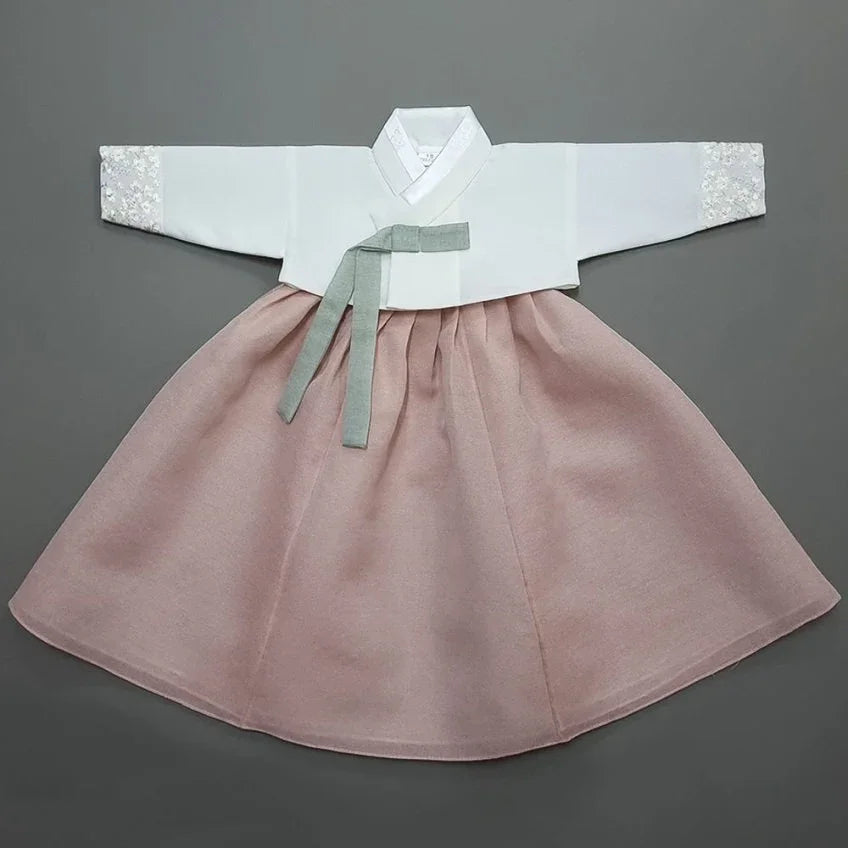 Yujin White Coral Girl Hanbok by Native Korean with white jeogori and coral pink chima.
